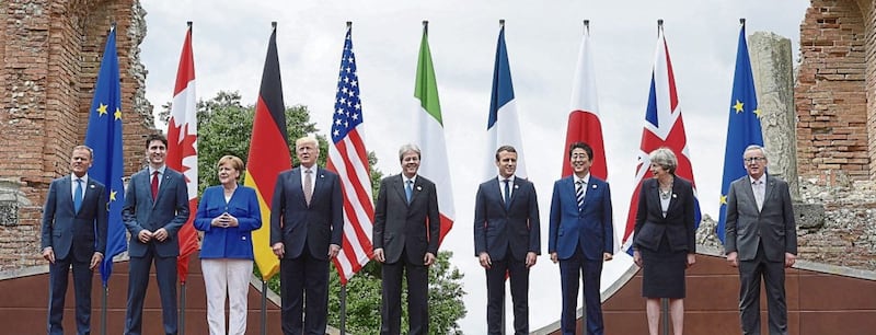 G7 leaders, from left, European Council President Donald Tusk, Canadian Prime Minister Justin Trudeau, German Chancellor Angela Merkel, US President Donald Trump, Italian Prime Minister Paolo Gentiloni, French President Emmanuel Macron, Japanese Prime Minister Shinzo Abe, British Prime Minister Theresa May, and European Commission President Jean-Claude Juncker, pose for a family photo at the Ancient Greek Theatre of Taormina, Sicily. PICTURE: Sean Kilpatrick/The Canadian Press via AP 