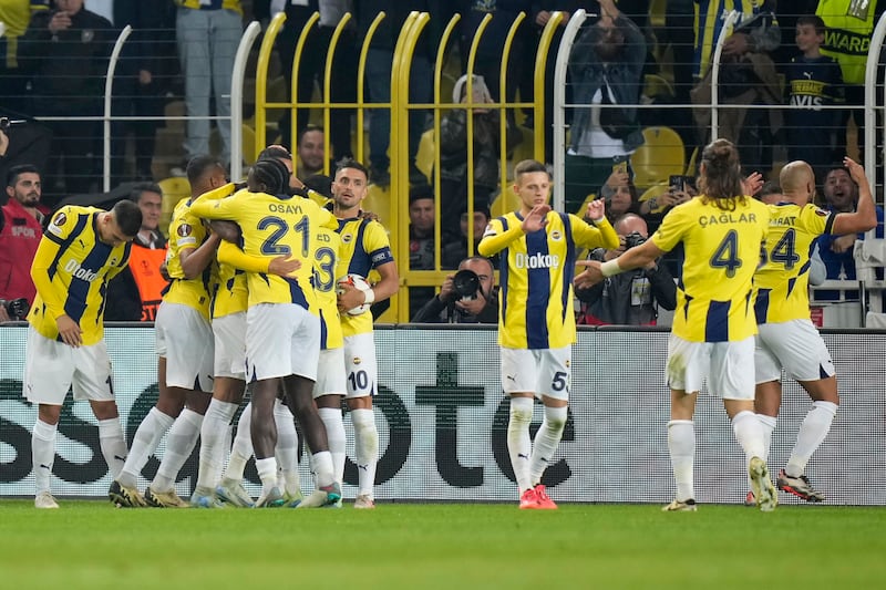 Fenerbahce celebrate the equaliser (Francisco Seco/AP)