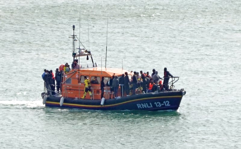 A group of people thought to be migrants are brought in to Dover onboard an RNLI lifeboat following a small boat incident in the English Channel