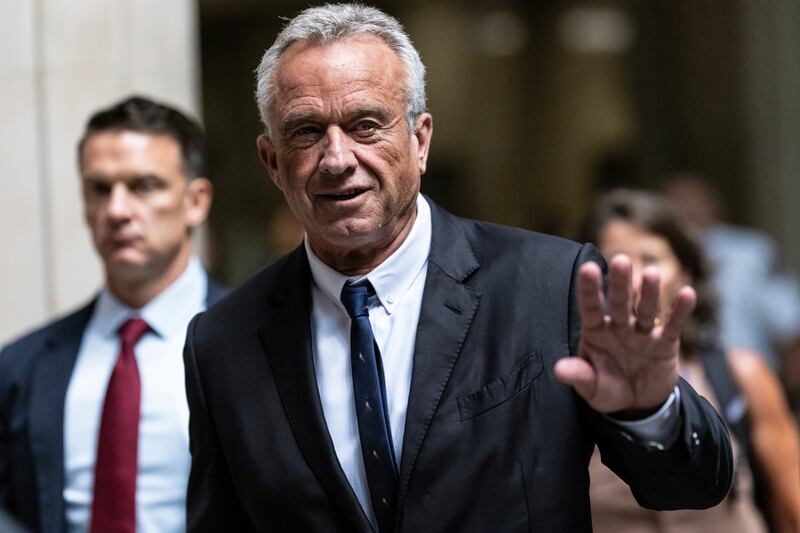 Robert F Kennedy Jr waves to the media outside the Nassau County Supreme Court in Mineola, New York (Stefan Jeremiah/AP)