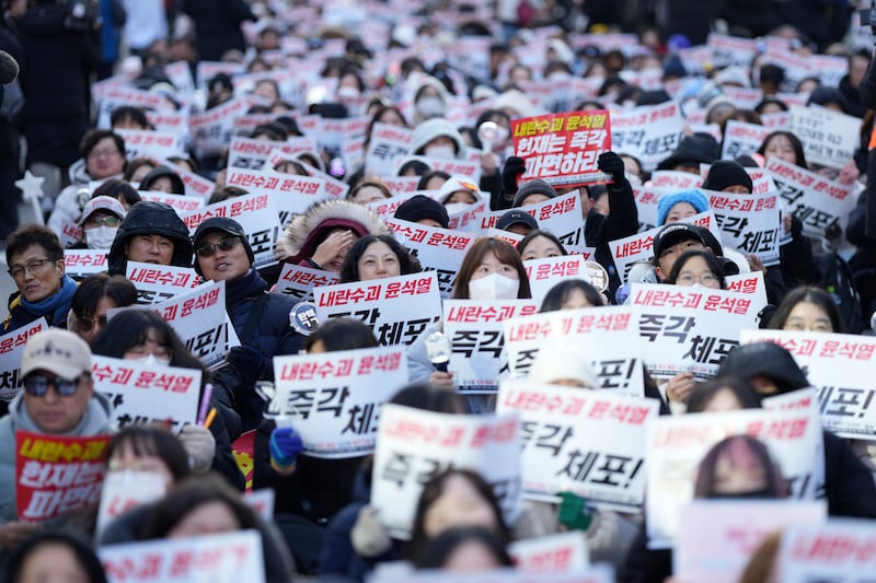 Participants shout slogans during a rally calling on the Constitutional Court to dismiss the President Yoon Suk Yeol in Seoul, South Korea (Lee Jin-man/AP)