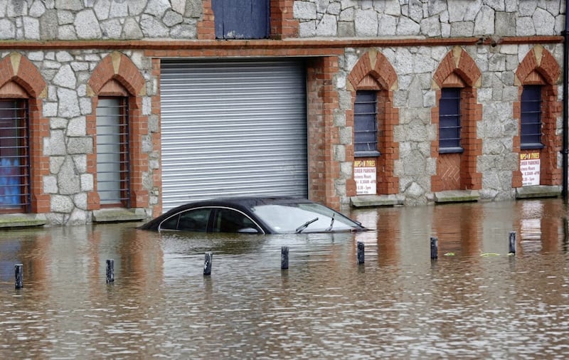 A car submerged by flood waters in Newry last November. PICTURE: MAL MCCANN