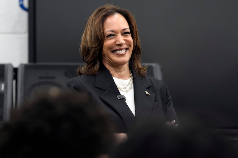 Kamala Harris speaks to marching band members at Liberty County High School in Hinesville, Georgia (Jacquelyn Martin/AP)