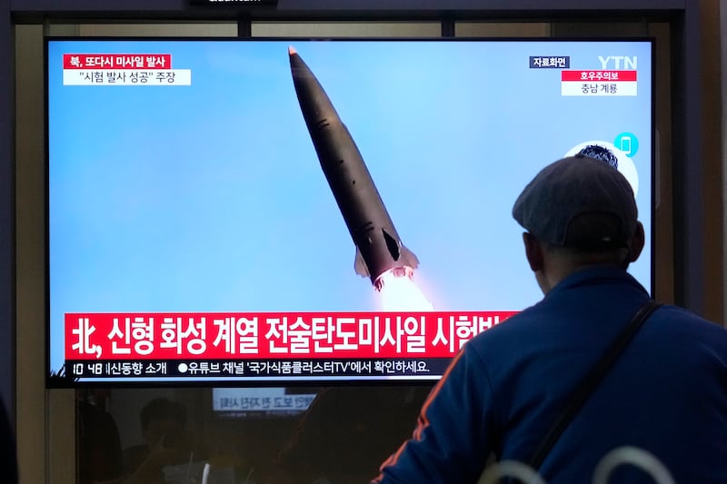 A TV screen shows a file image of North Korea’s missile launch during a news programme at Seoul Railway Station in Seoul, South Korea (Ahn Young-joon/AP)