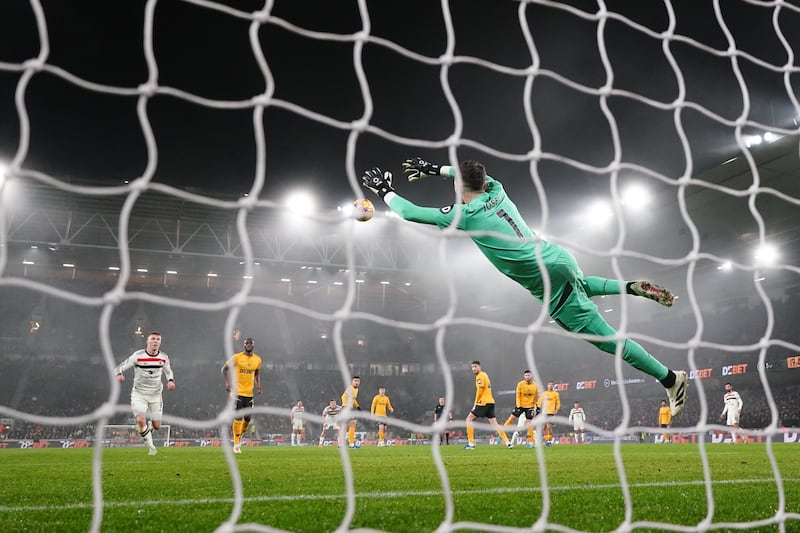 Jose Sa saves a shot from Manchester United’s Diogo Dalot