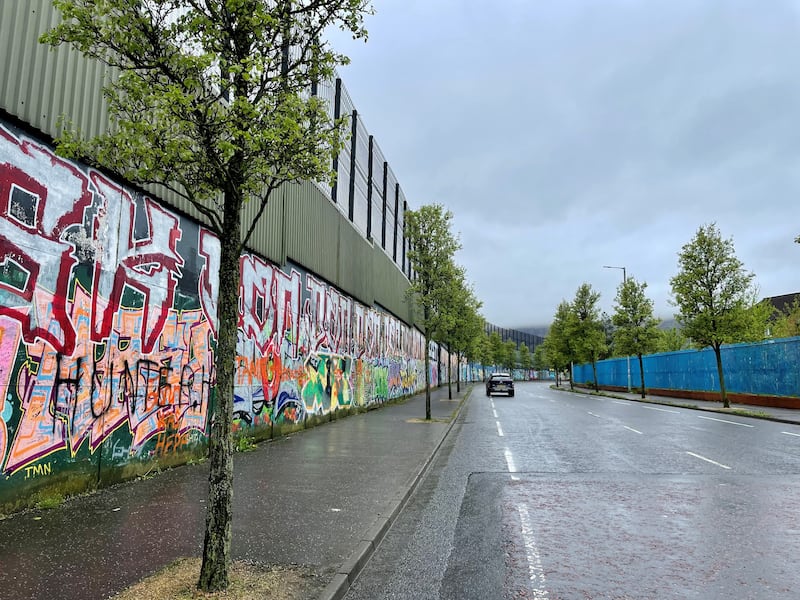 Peace wall on Cupar Way in Belfast .