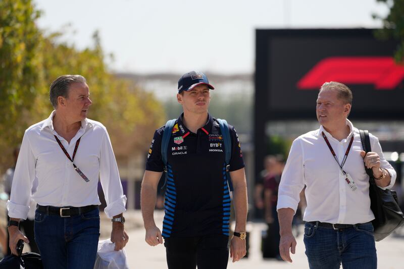 Max Verstappen (centre) walks with his manager Raymond Vermeulen (left) and father Jos Verstappen (right) at the Bahrain Grand Prix (AP Photo/Darko Bandic)