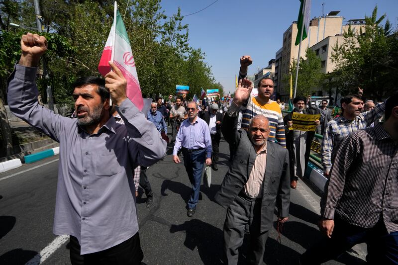 Iranian worshippers chant slogans during an anti-Israeli gathering after Friday prayers in Tehran (Vahid Salemi/AP)