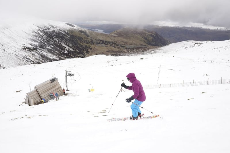 A skier makes their way down the slope at the Lake District Ski Club 