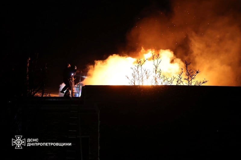 Rescue workers put out a fire in Dnipro (Ukrainian Emergency Service via AP)