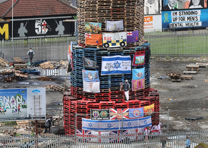 An Apprentice Boys of Derry collar is added to the bonfire currently being built in the Derry Bogside that is due to be lit tonight August 15th. Picture Margaret McLaughlin  15-8-2024