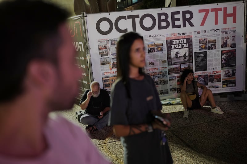 People visit a memorial in Tel Aviv marking the one-year anniversary of the Hamas attack on Israel (Oded Balilty/AP)