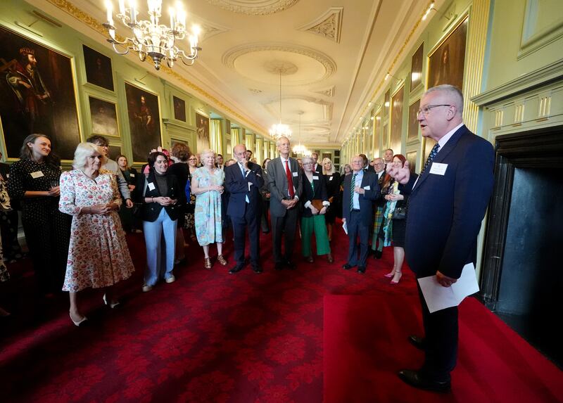Camilla listens as broadcaster Allan Little (right) speaks at a celebration at the Palace of Holyroodhouse in Edinburgh for those who promote Scottish literacy