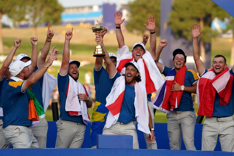 Team Europe's Rory McIlroy lifts the Ryder Cup Trophy after Europe regained the Ryder Cup following victory over the USA on day three of the 44th Ryder Cup at the Marco Simone Golf and Country Club, Rome, Italy on Sunday October 1, 2023. Picture by David Davies, PA.