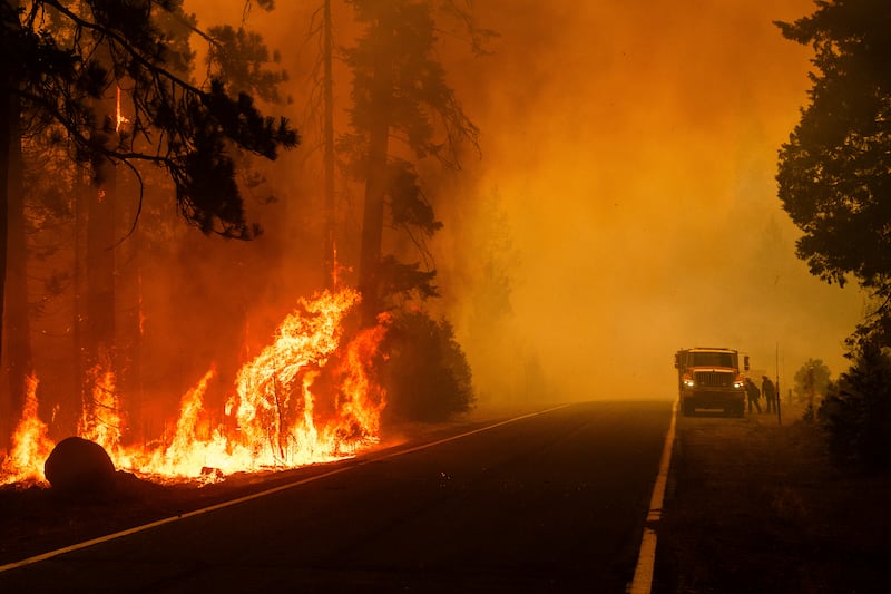 Firefighters are also tackling huge blazes in California (AP)