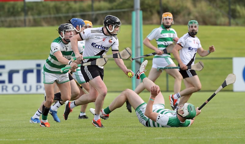 Swatragh's Dominic Bradley gets away from Kevin McAllister with Darragh Mullan of Kevin Lynch