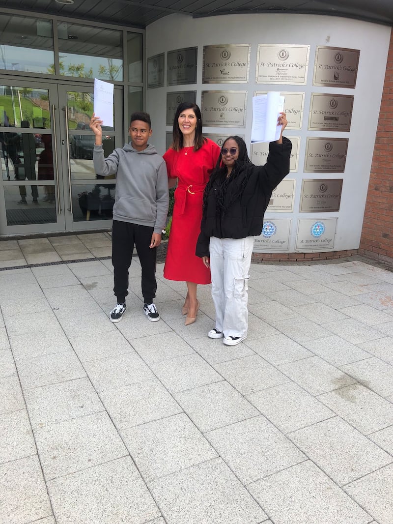 Brother and sister John and Juliet celebrate their results along with principal Catherine McHugh at St Patrick's College, Dungannon. Pic: CCEA