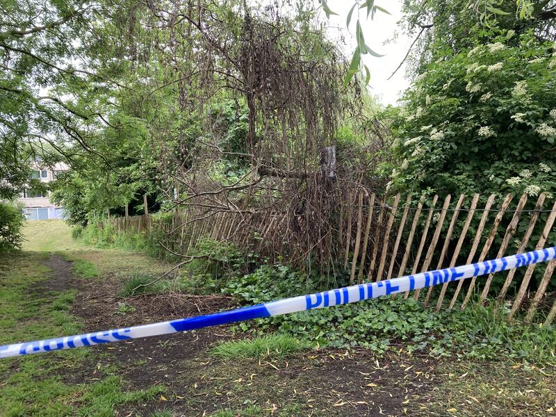 Police tape at the scene where body parts were found