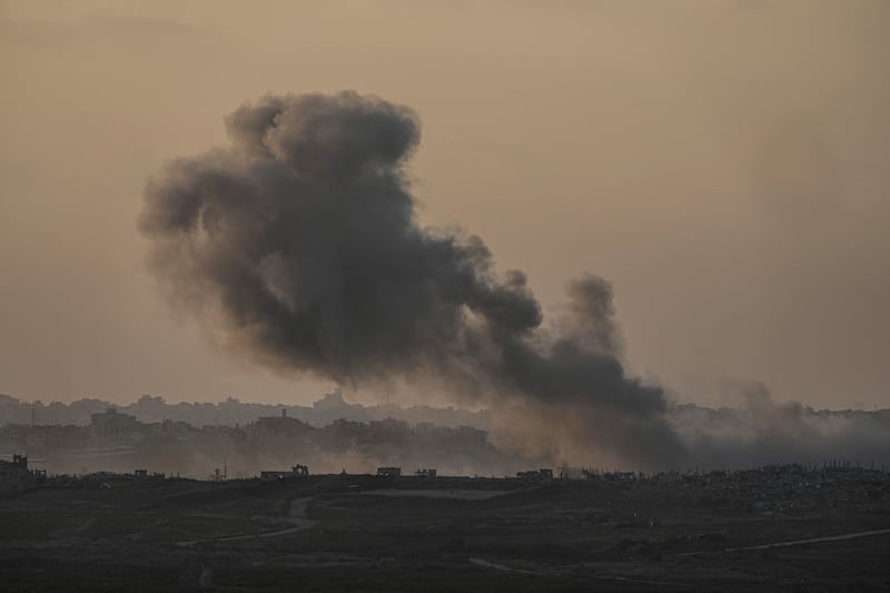 Smoke rises following an Israeli air strike in the Gaza Strip (Tsafrir Abayov/AP)