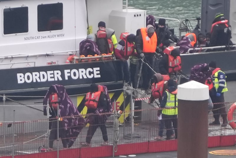 A group of people thought to be migrants are brought in to Dover