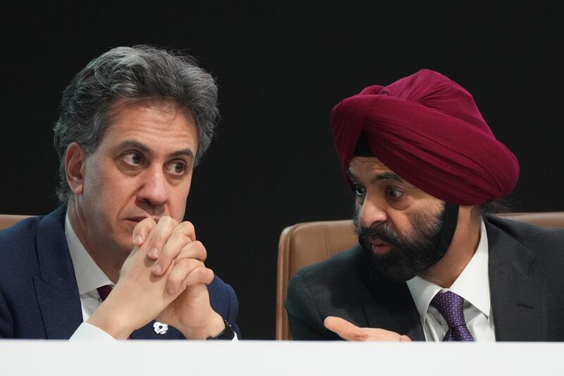 Ajay Banga, World Bank president, right, and Energy Secretary Ed Miliband during Cop29 (Sergei Grits/AP)