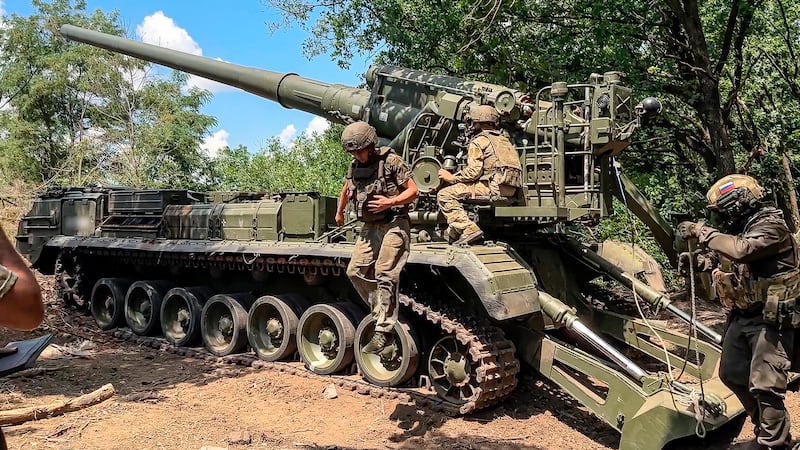 Russian soldiers operate 2S7M Malka self-propelled cannon (Russian Defence Ministry Press Service via AP)