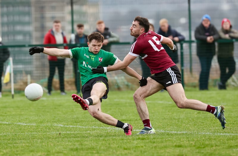 St Mary’s Declan Loye and Queen’s Padraig Purcell  during Sundays Sigerson Cup game at Davitt Park in Belfast.
PICTURE COLM LENAGHAN