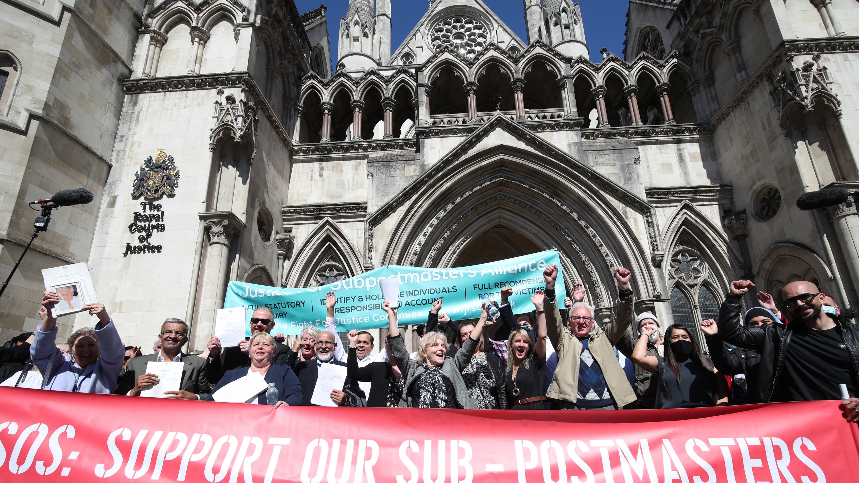 Former post office workers outside the Royal Courts of Justice in 2021