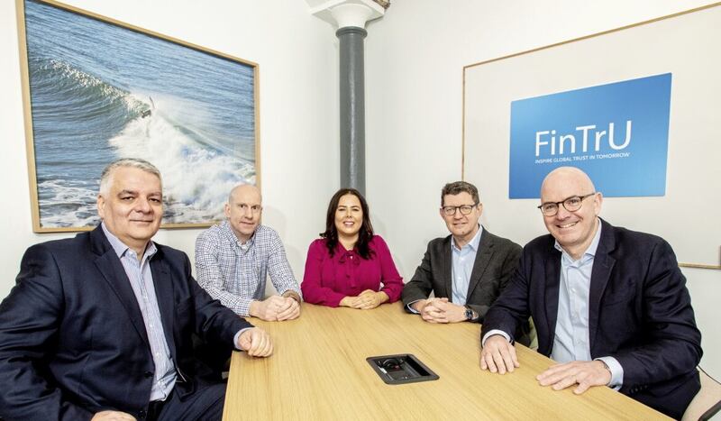 FinTrU founder and chief executive Darragh McCarthy (right) pictured at the Derry investment announcement with (from left) Mel Chittock (Invest NI interim chief executive) and FinTru&#39;s chief financial officer Steven Murtland and executive directors Kathleen McDermott and Greg McCann 