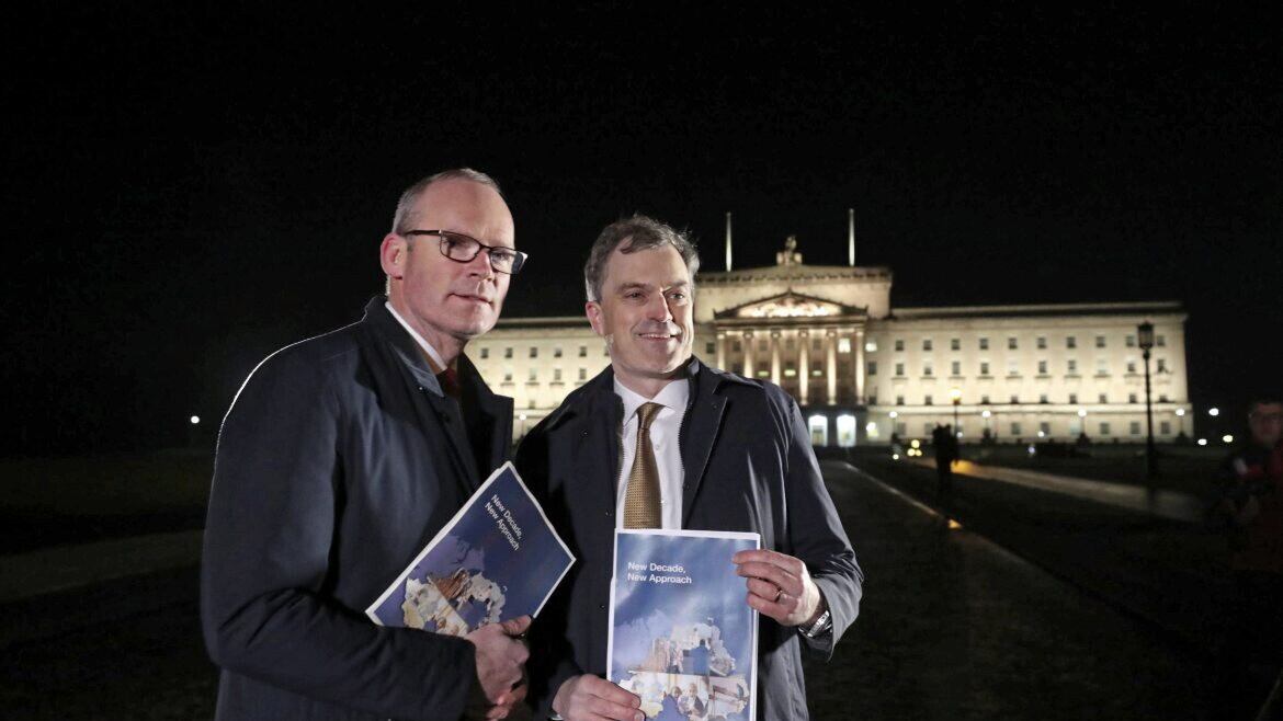Foreign affairs minister Simon Coveney and then Secretary of State Julian Smith launch the New Decade, New Approach agreement in January 2020. Picture by Niall Carson/PA Wire
