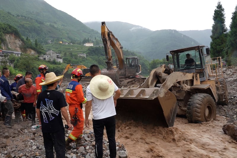 Rescue workers in Xinhua village (Ya’an Integrated Media Centre/Xinhua/AP)