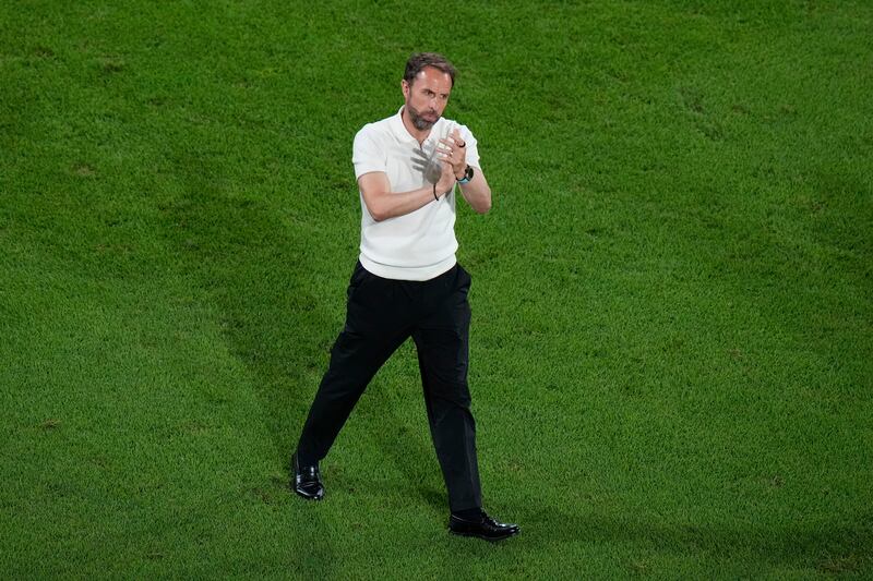 England coach Gareth Southgate applauds on the pitch after the draw with Slovenia (Alessandra Tarantino/AP)