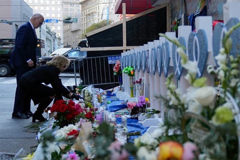 President Joe Biden and first lady Jill Biden lay flowers at the site of the deadly New Years truck attack (Stephanie Scarbrough/AP)