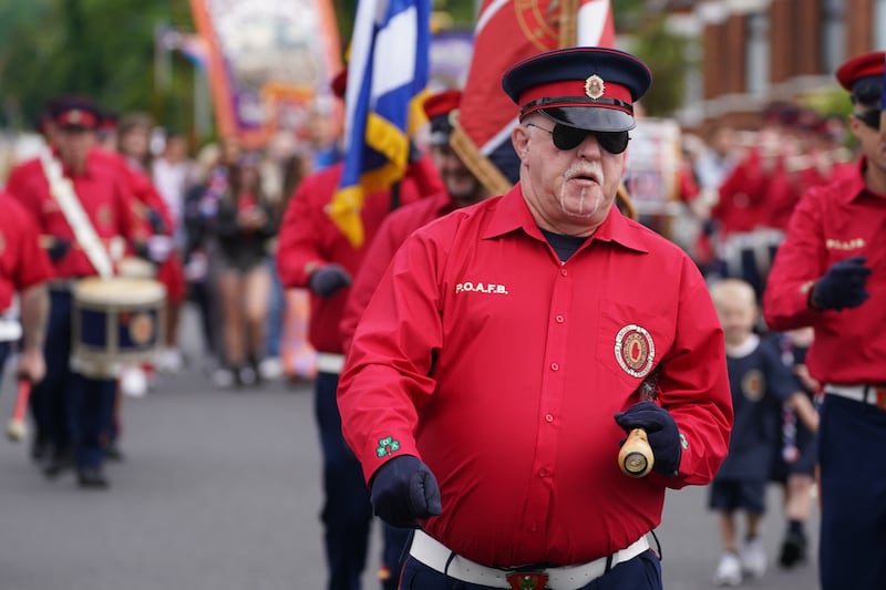 An Orange Order parade makes its way along the Crumlin Road on the morning of the Twelfth this year .