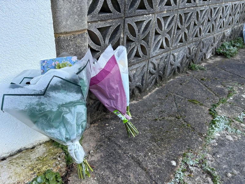 Flowers left on the driveway of a house in Anthony’s Avenue, Poole, Dorset, where an elderly couple were found dead on December 31.