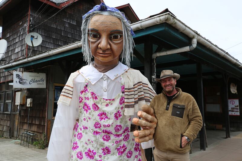 Nick with a giant puppet used to entertain children at live shows on the Chiloe Islands in Chile
