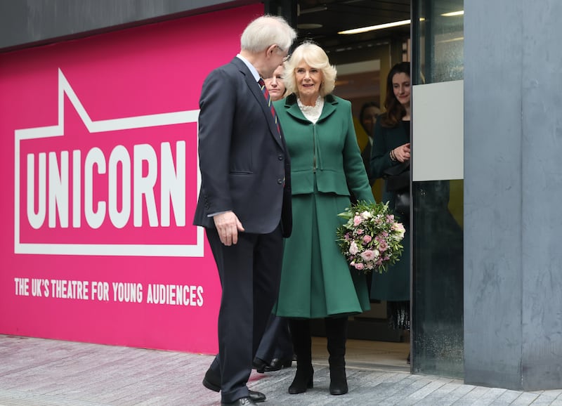 Queen Camilla smiles as she departs, after a visit to the Unicorn Theatre, London