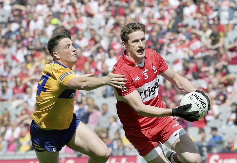 Derry&#39;s Brendan Rogers with Keelan Sexton of Clare during the 2022 All-Ireland SFC quarter-final at Croke Park. Picture Margaret McLaughlin 