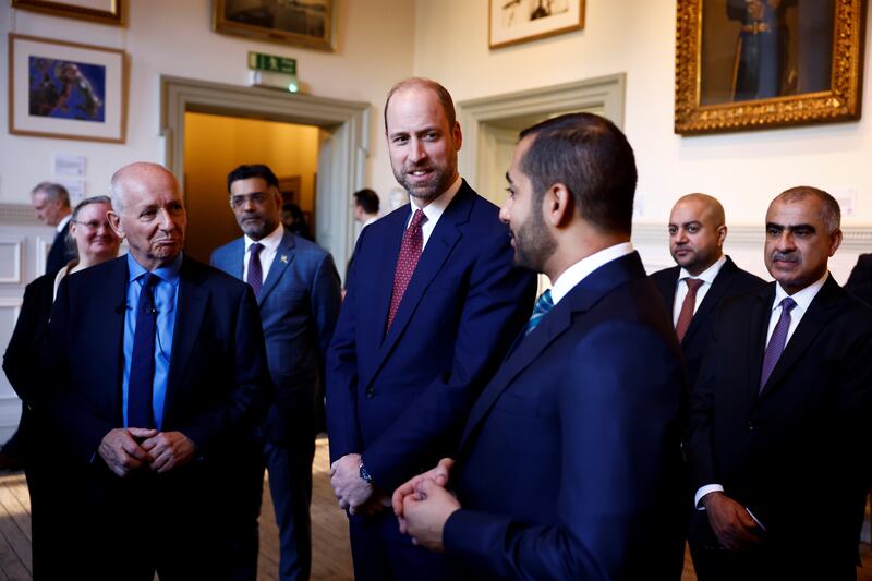 William (centre) and Theyazin bin Haitham listen to British explorer Mark Evans (left)