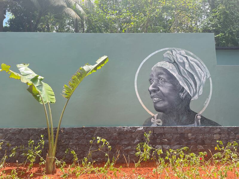 A mural of the local community on a wall at Bom Bom