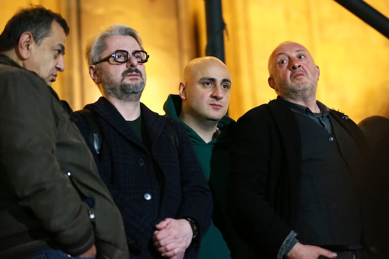 Opposition figure David Berdzenishvii, leaders of Strong Georgia Coalition Nika Gvaramia and Nika Melia, and former president of Georgia Giorgi Margvelashvili attend the protest (Zurab Tsertsvadze/AP)