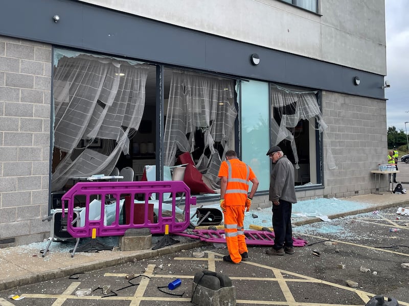 Damage at the Holiday Inn Express in Rotherham, South Yorkshire, where anti-immigration rioters smashed the windows before starting fires on Sunday