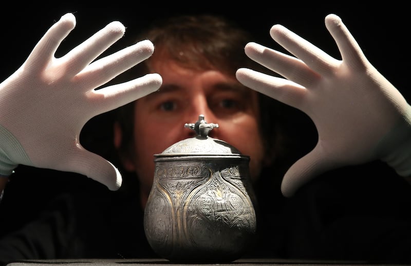 Curator Martin Goldberg with a 3D reconstruction of a lidded vessel found as part of the Galloway Hoard