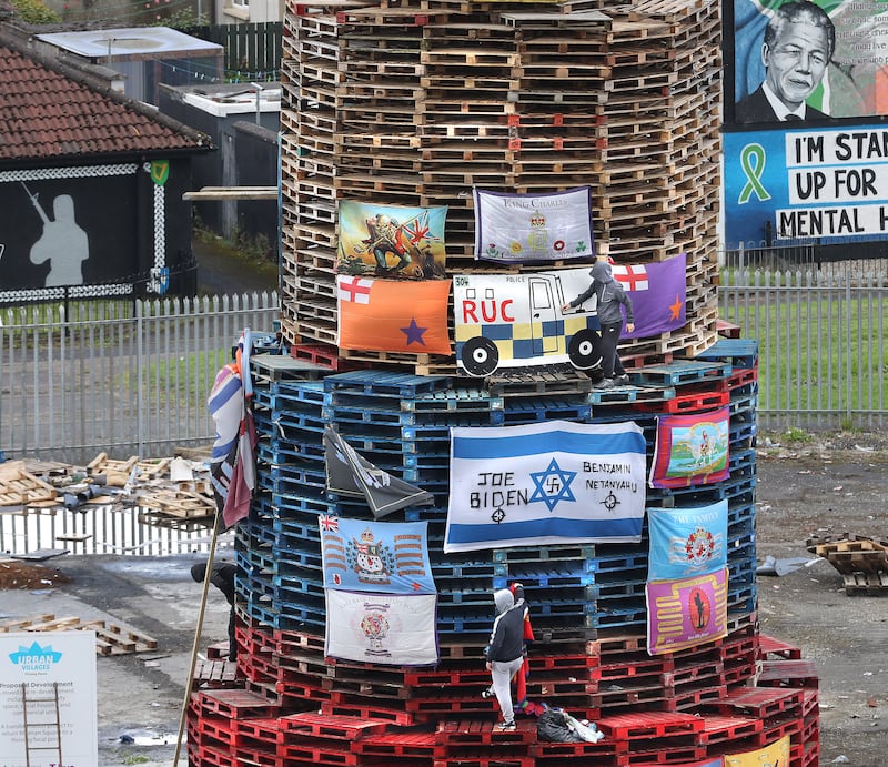 An image of a police vehicle is added to the bonfire currently being built in the Derry Bogside that is due to be lit tonight August 15th. Picture Margaret McLaughlin  15-8-2024