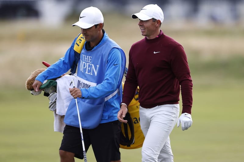 Northern Ireland's Rory McIlroy (right) with caddie Harry Diamond on the 5th hole during a practice round ahead of The Open at the Royal Liverpool, Wirral. Picture by Richard Sellers, PA.