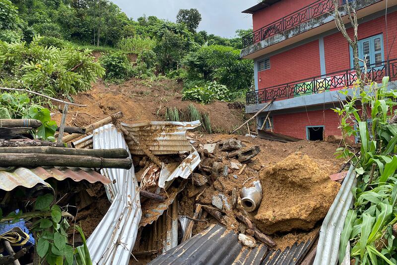 The buses fell into the river after a landslide (AP)