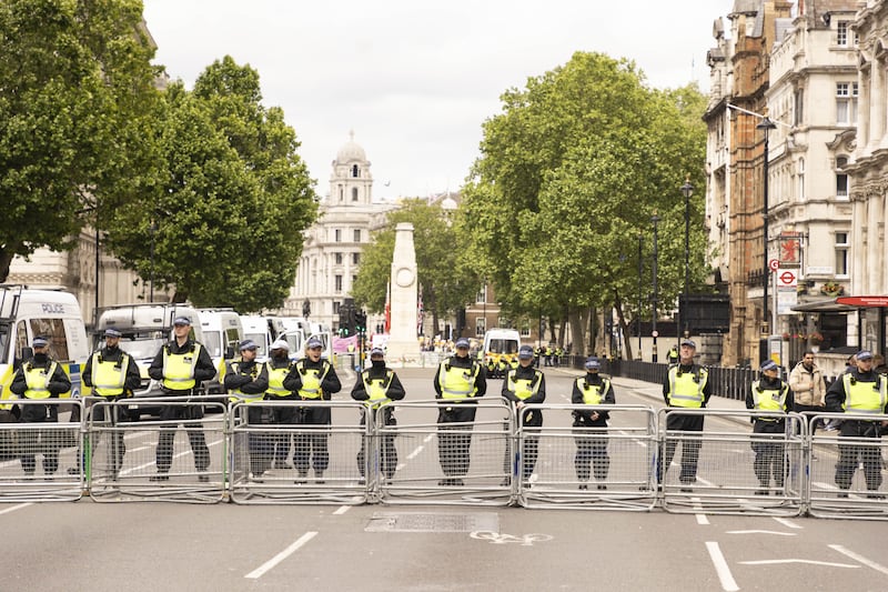 A police barrier in London between two protests by Stand up to Racism and a protest march organised by Tommy Robinson in June