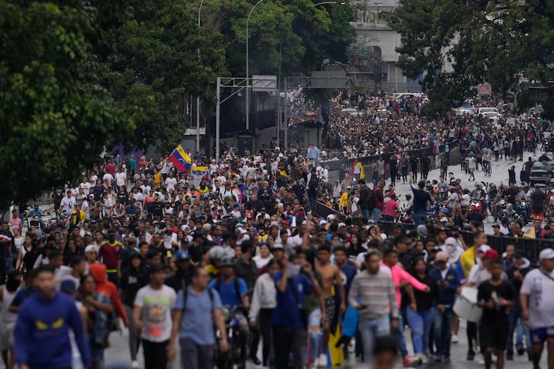 Protesters demonstrate against the official election results declaring President Nicolas Maduro the winner (Matias Delacroix/AP)