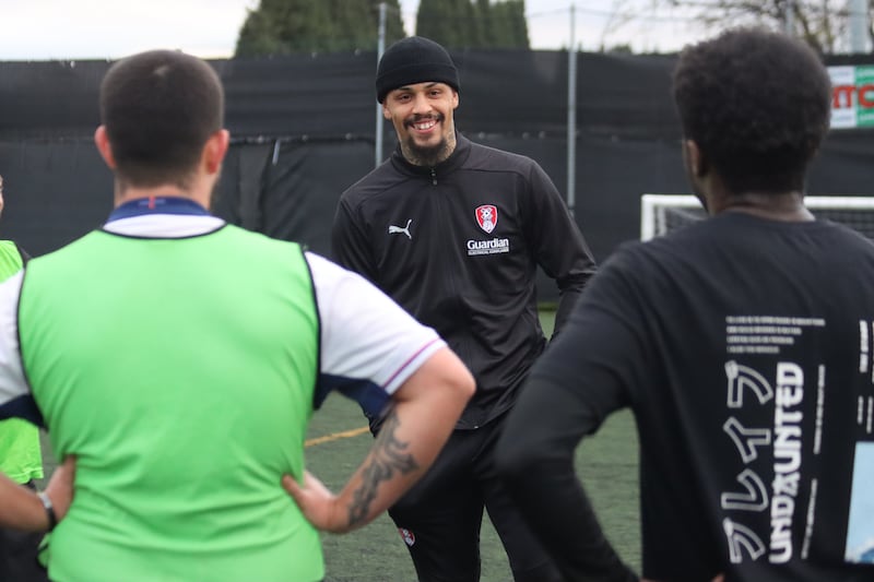 Rotherham striker Jonson Clarke-Harris speaks to players at U4C