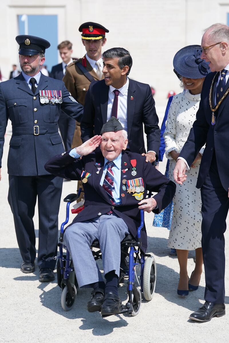 Prime Minister Rishi Sunak wheels Mr Morgan as they head to lunch following the UK national commemorative event for the 80th anniversary of D-Day